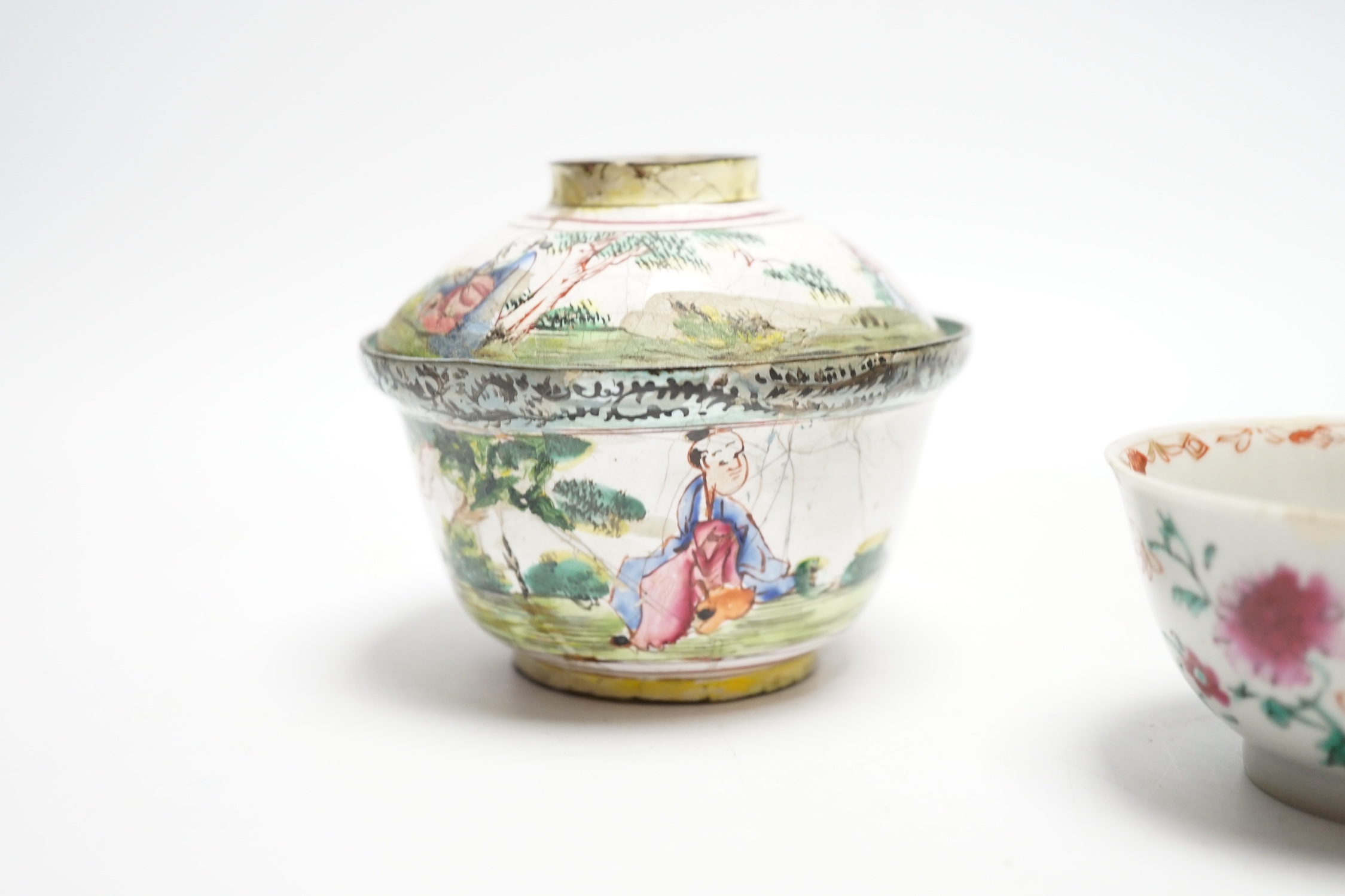 A Chinese Canton enamel tea bowl and cover, and a porcelain tea bowl, largest 8cm high